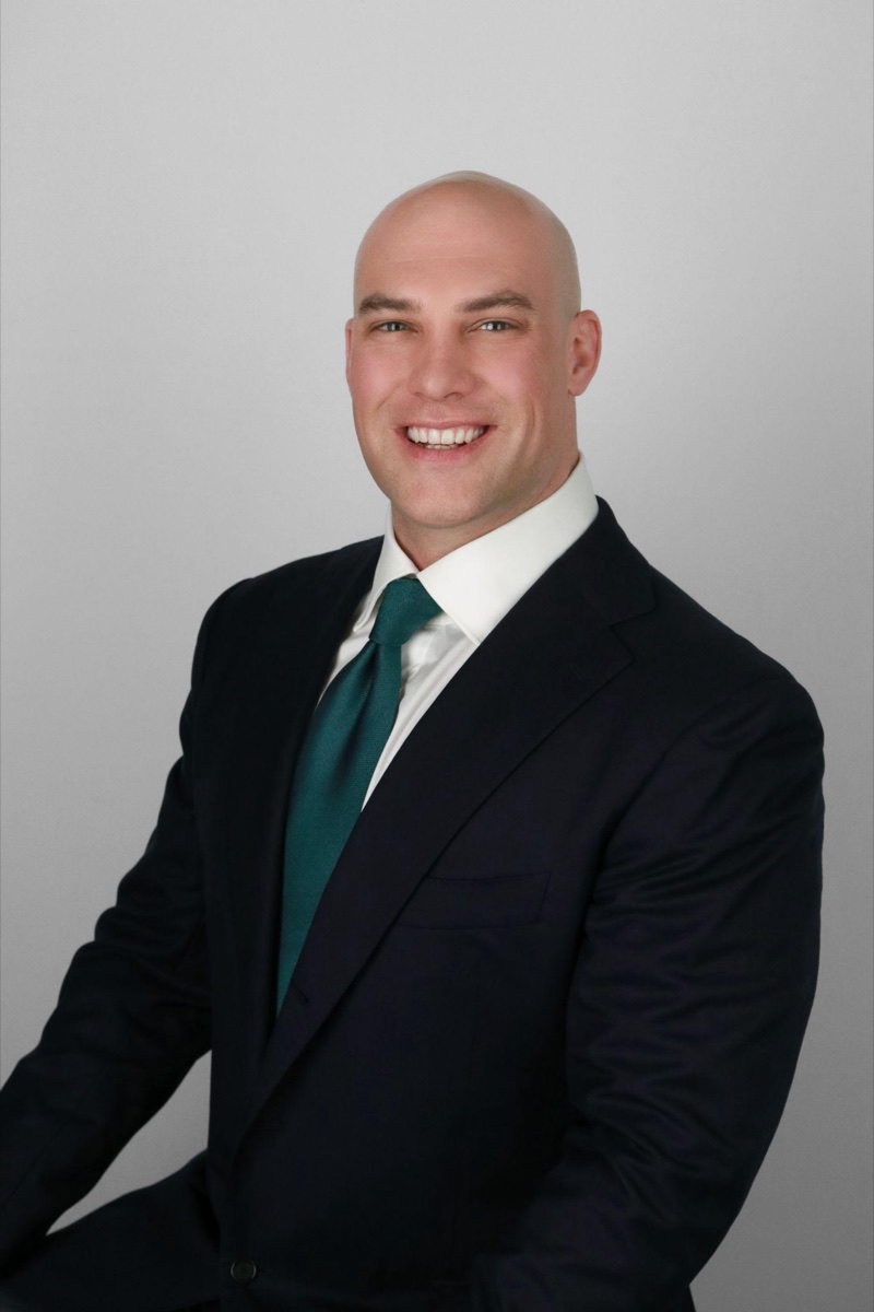 Tech and startup headshot example: a professional in smart business-casual attire with a confident, forward-looking expression