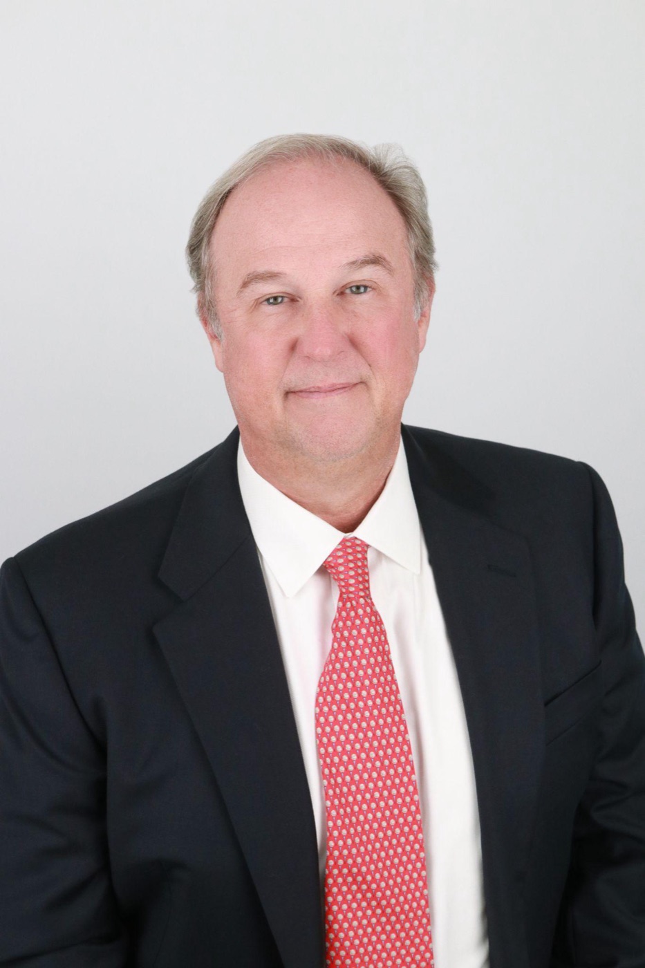 A clean, well-lit professional headshot produced affordably in a self-service studio